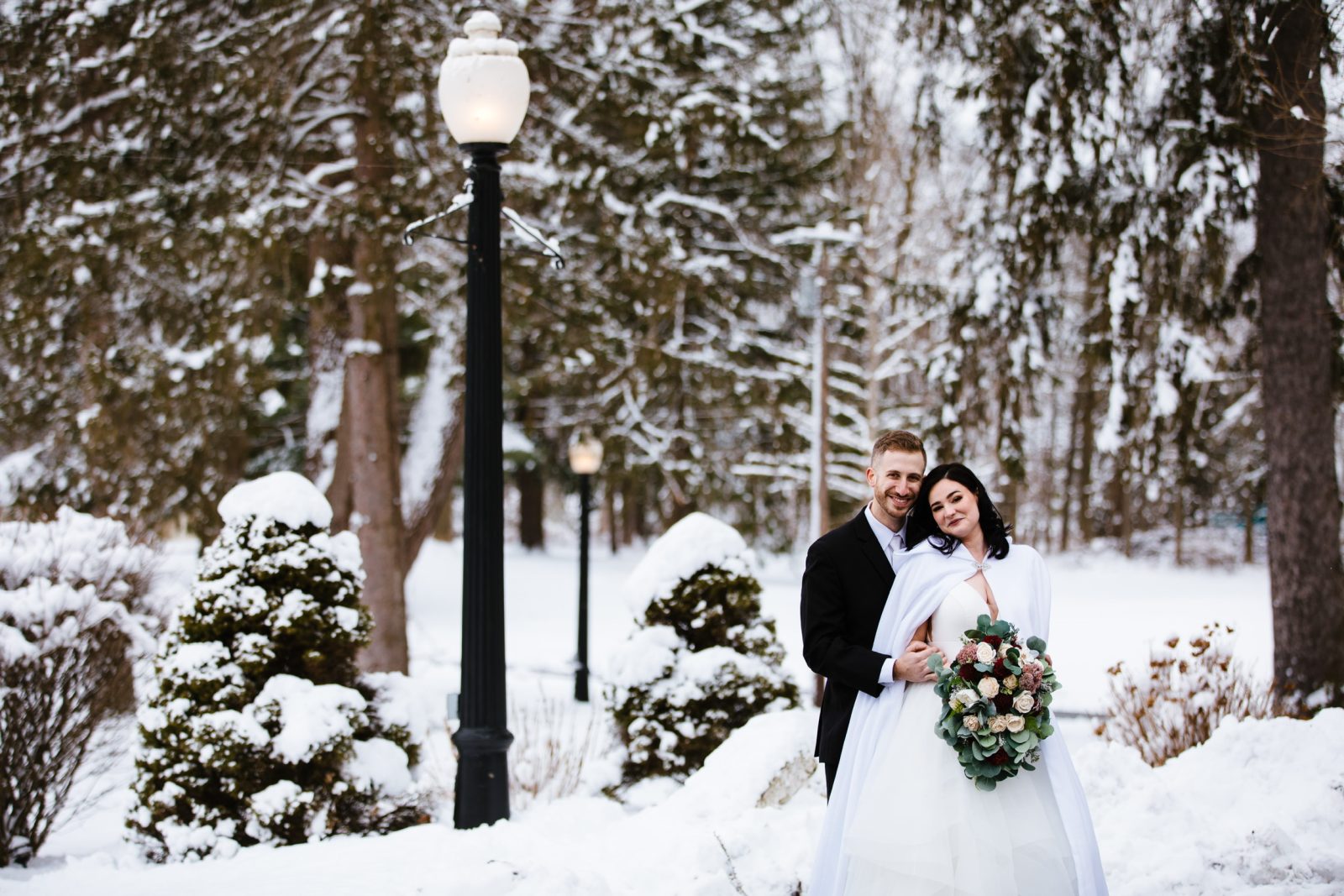 Bride and groom wedding portrait in snowy central new york at the Springside inn venue