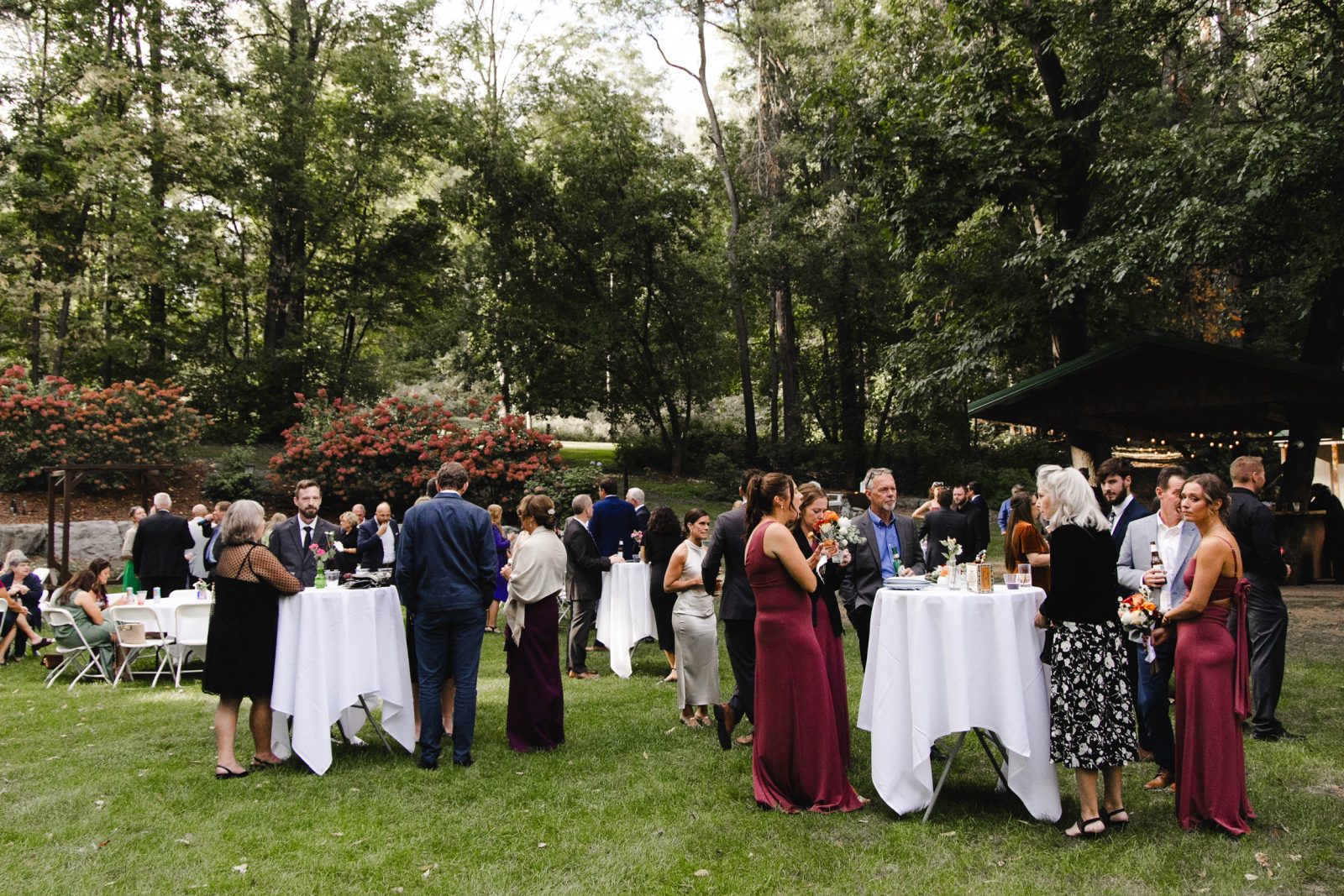 Outdoor cocktail hour in The Grove behind the historic Springside Inn Wedding Venue