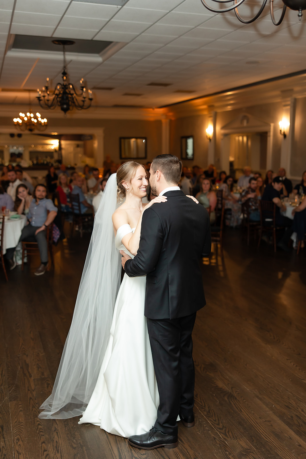 Bride and Groom happily dancing during first dance at their wedding reception at historic Springside Inn