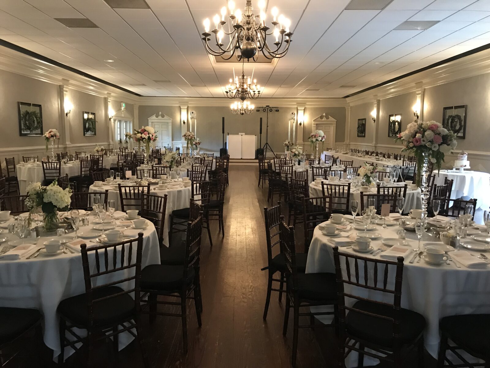 Decorated tables line the Heritage Room for a wedding reception