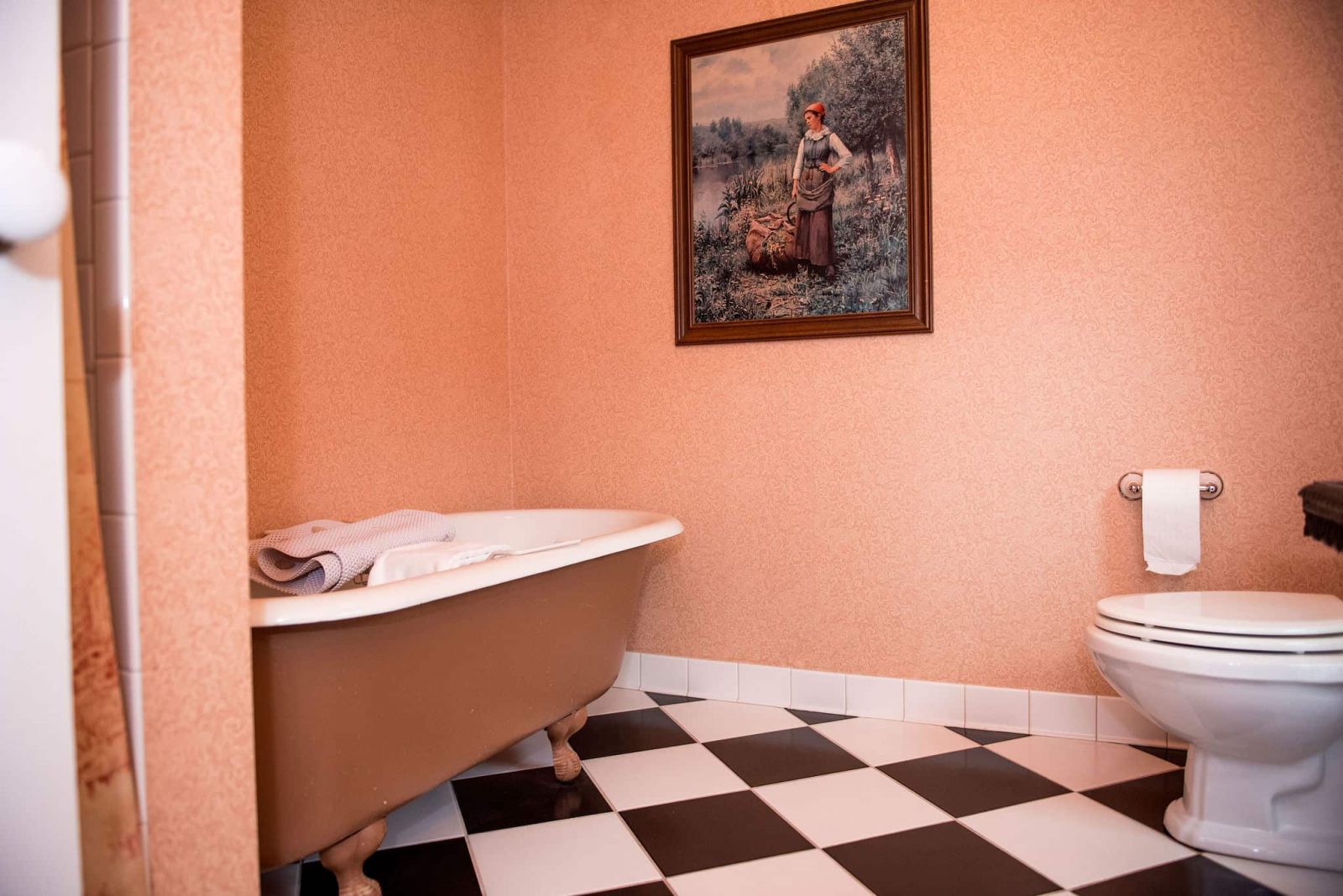 Room 32 bathroom interior facing the claw-foot tub